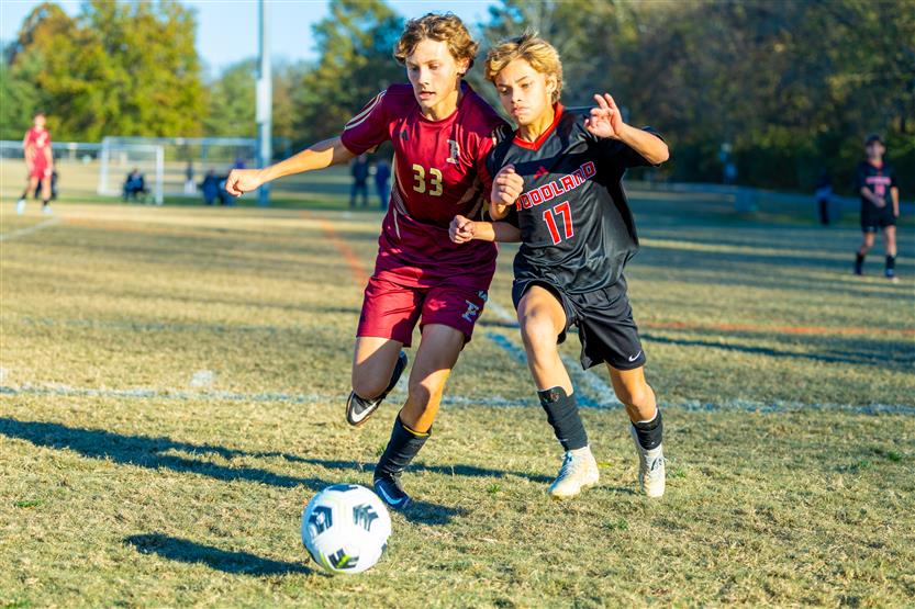 Middle school students play soccer